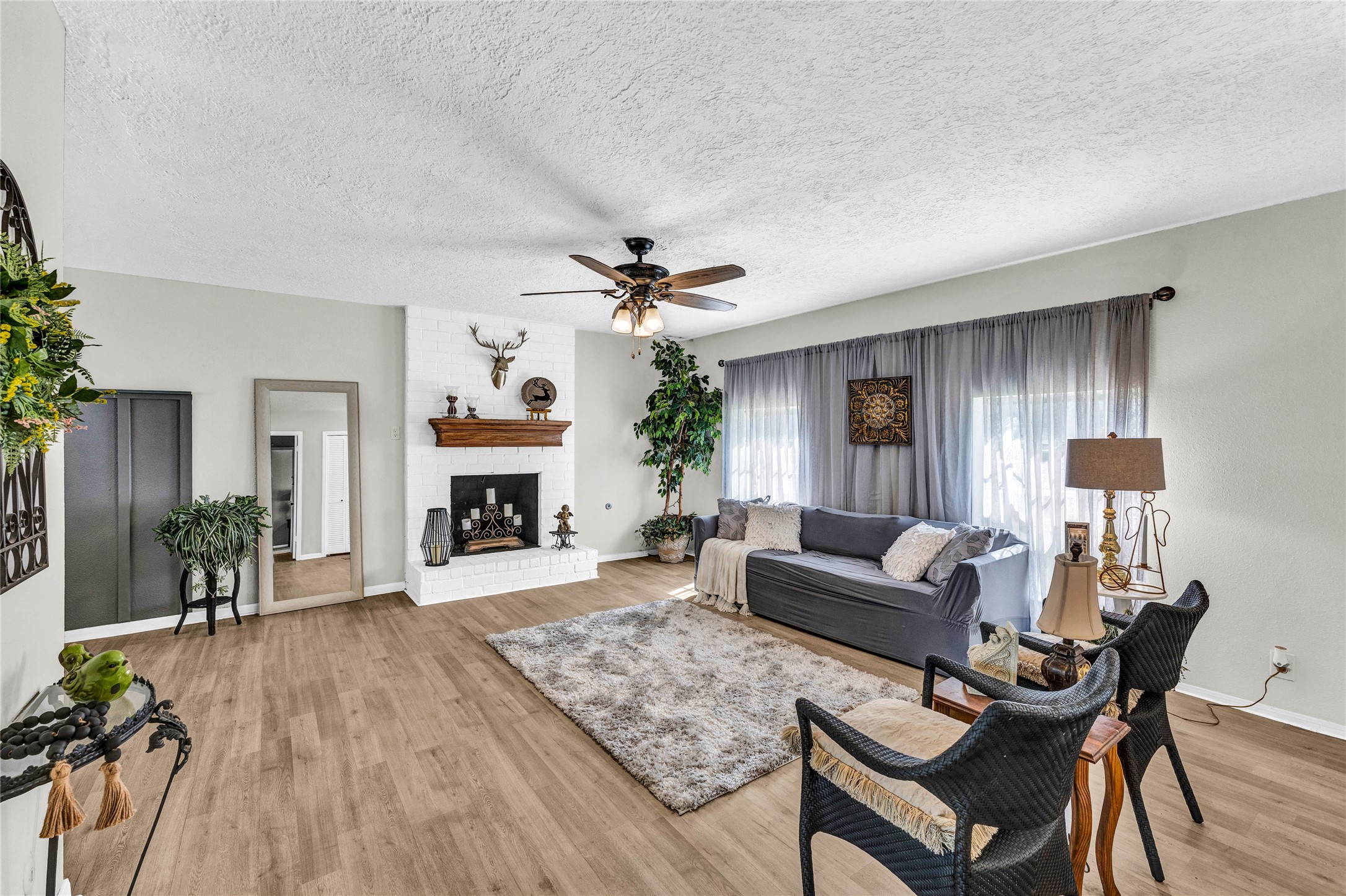 2705 Parrott Avenue Rosenberg, TX 77471 - Photo 6 of 27 a living room with furniture and a fireplace