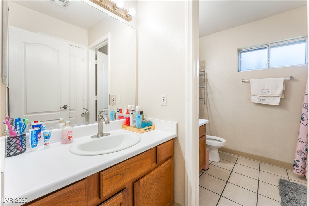 4656 East Desert Inn Road Las Vegas, NV 89121 - Photo 72 of 98 4652 E DI Bathroom with vanity and tile patterned floors