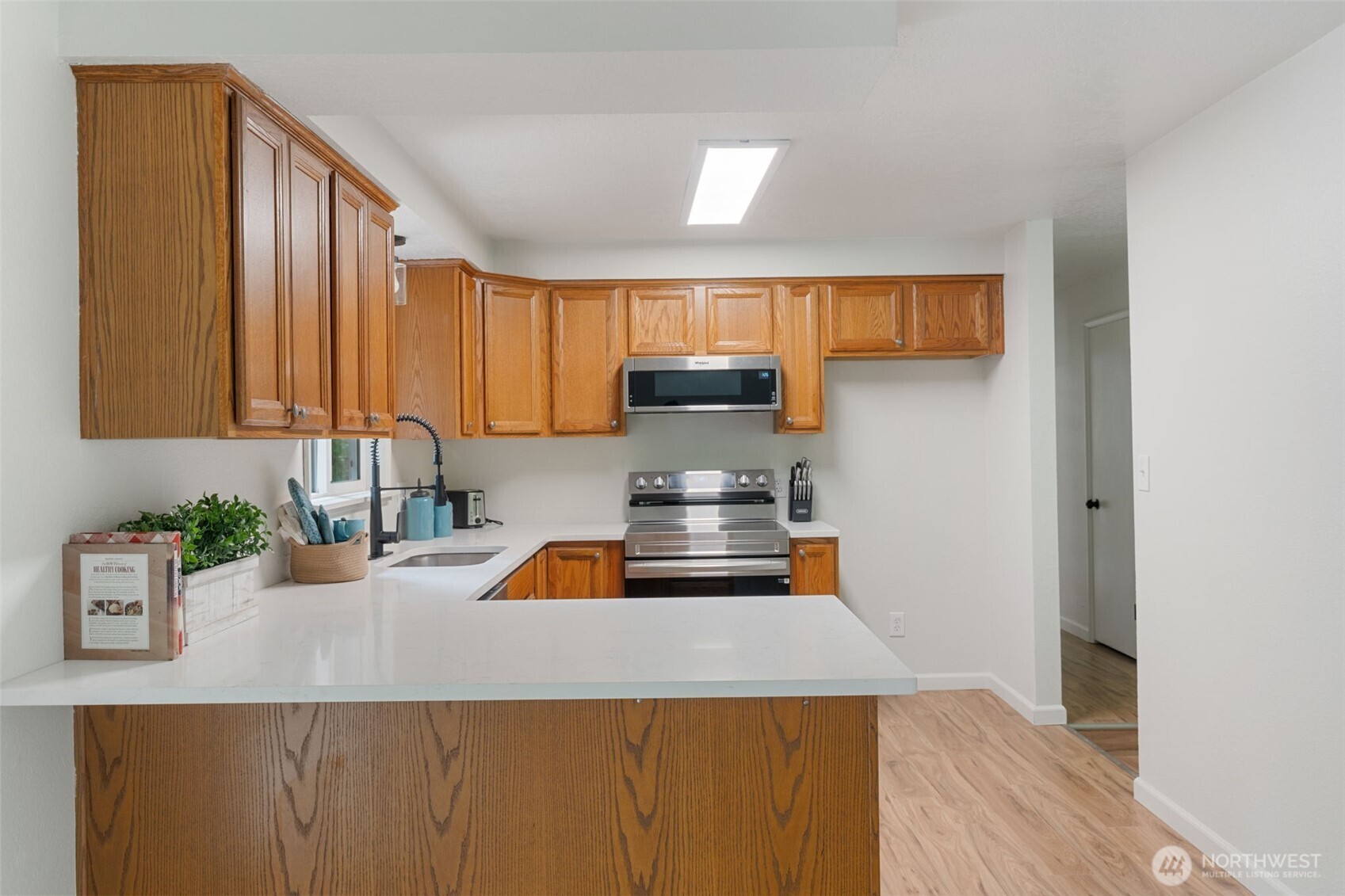 115 Maschke Road Vader, WA 98593 - Photo 14 of 40 a kitchen with a sink a stove and cabinets