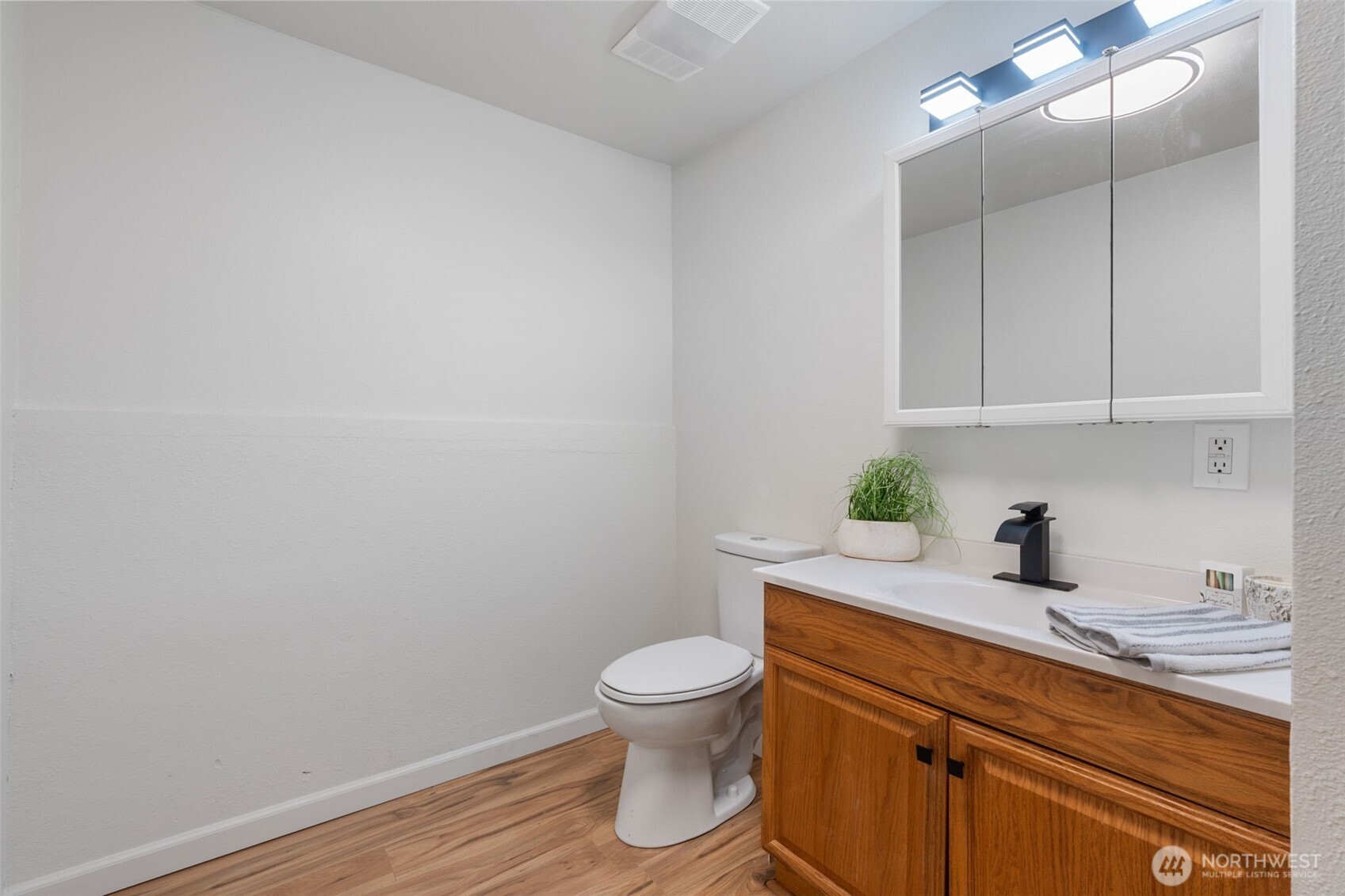 115 Maschke Road Vader, WA 98593 - Photo 25 of 40 a bathroom with a granite countertop toilet and a sink