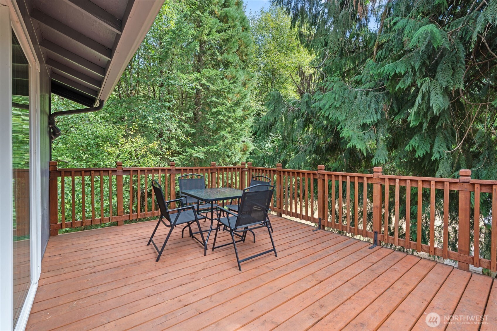 115 Maschke Road Vader, WA 98593 - Photo 26 of 40 a view of a deck with furniture and wooden floor