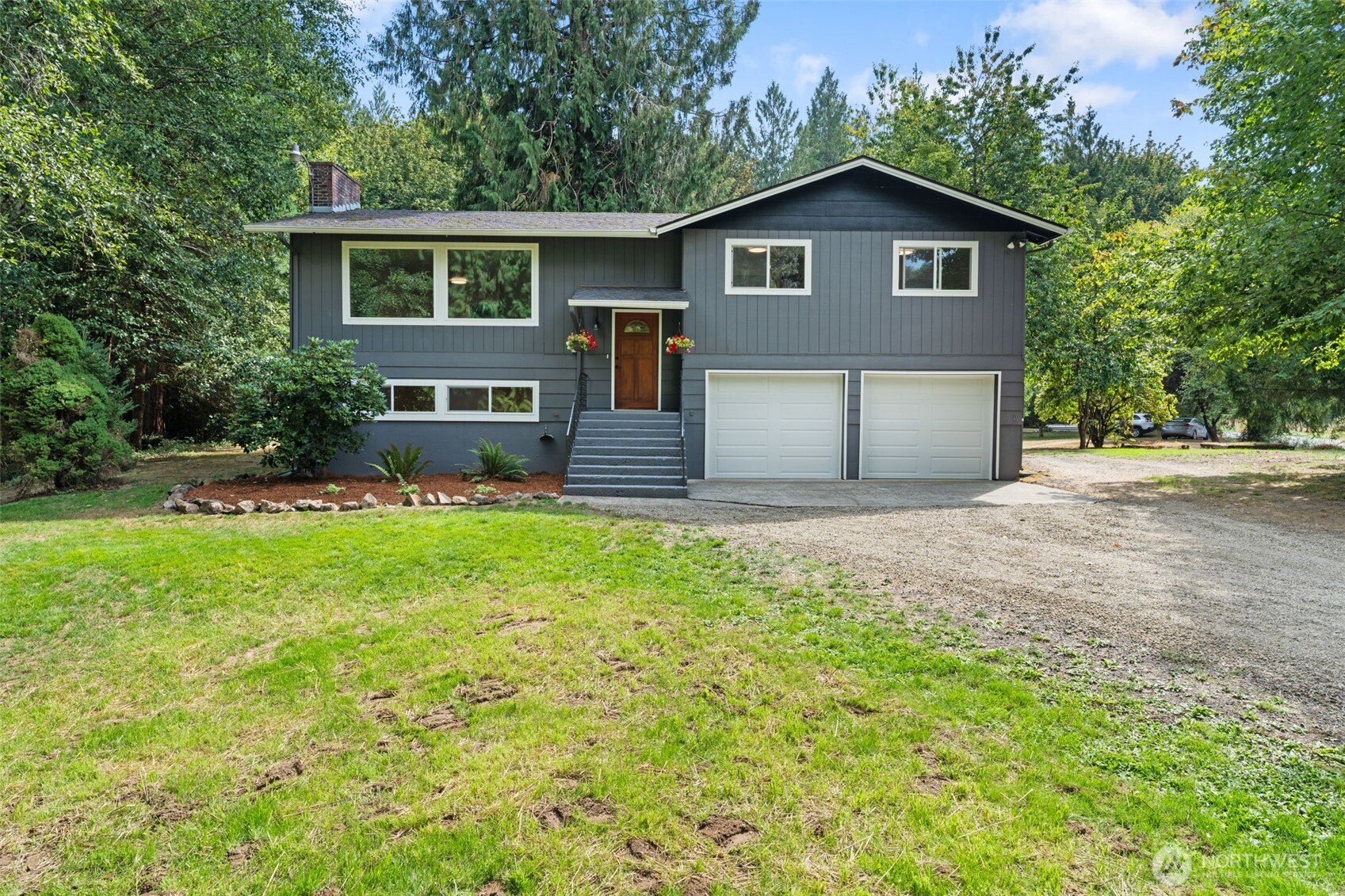 115 Maschke Road Vader, WA 98593 - Photo 3 of 40 a front view of a house with a garden and yard