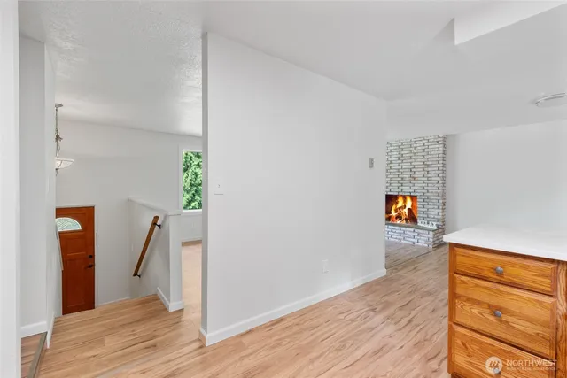 a view of hallway with wooden floor