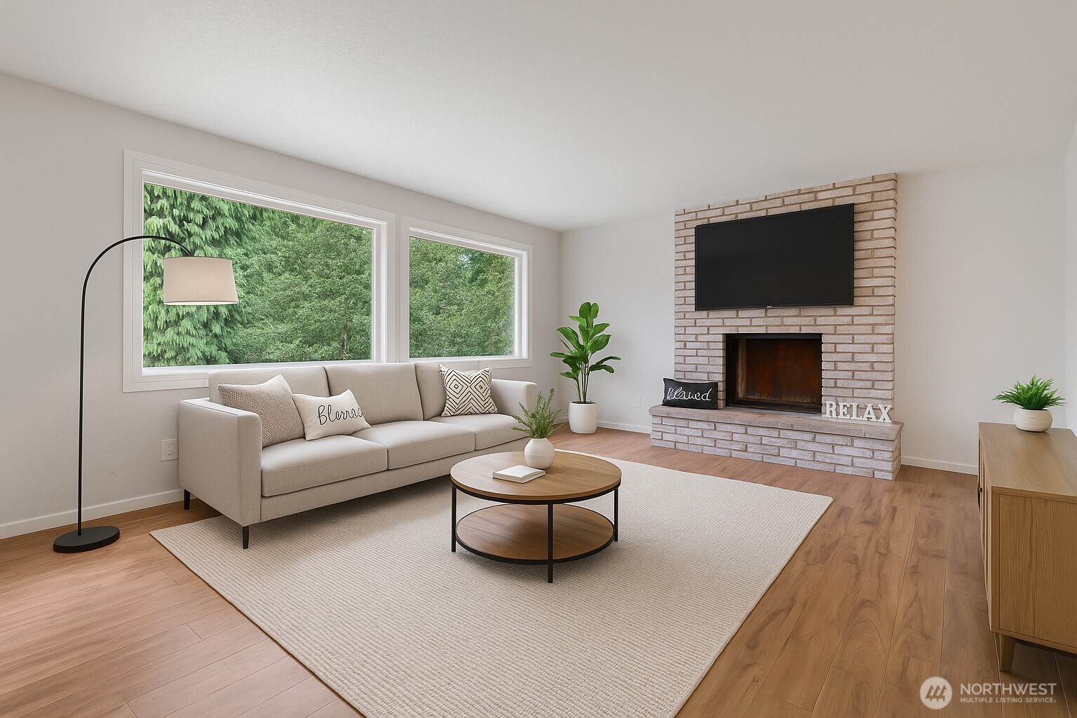 115 Maschke Road Vader, WA 98593 - Photo 8 of 40 a living room with furniture a flat screen tv and a fireplace
