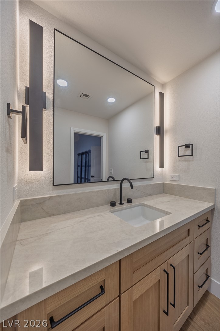 8800 Lusso Las Vegas, NV 89134 - Photo 70 of 85 Bathroom with a textured wall and vanity