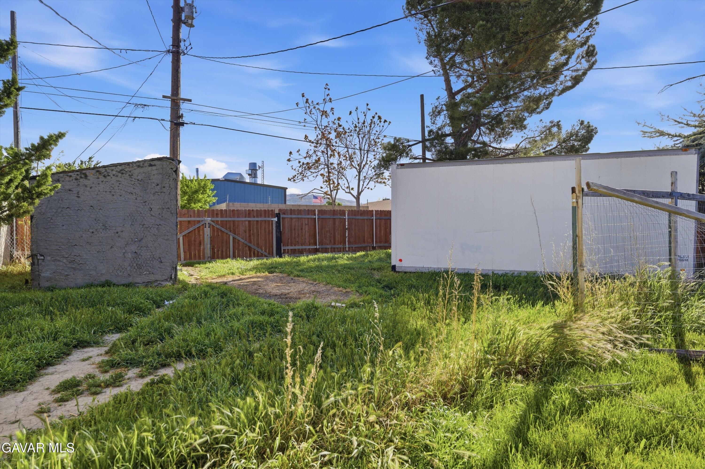 124 I Street East Tehachapi, CA 93561 - Photo 13 of 15 a view of a backyard with potted plants