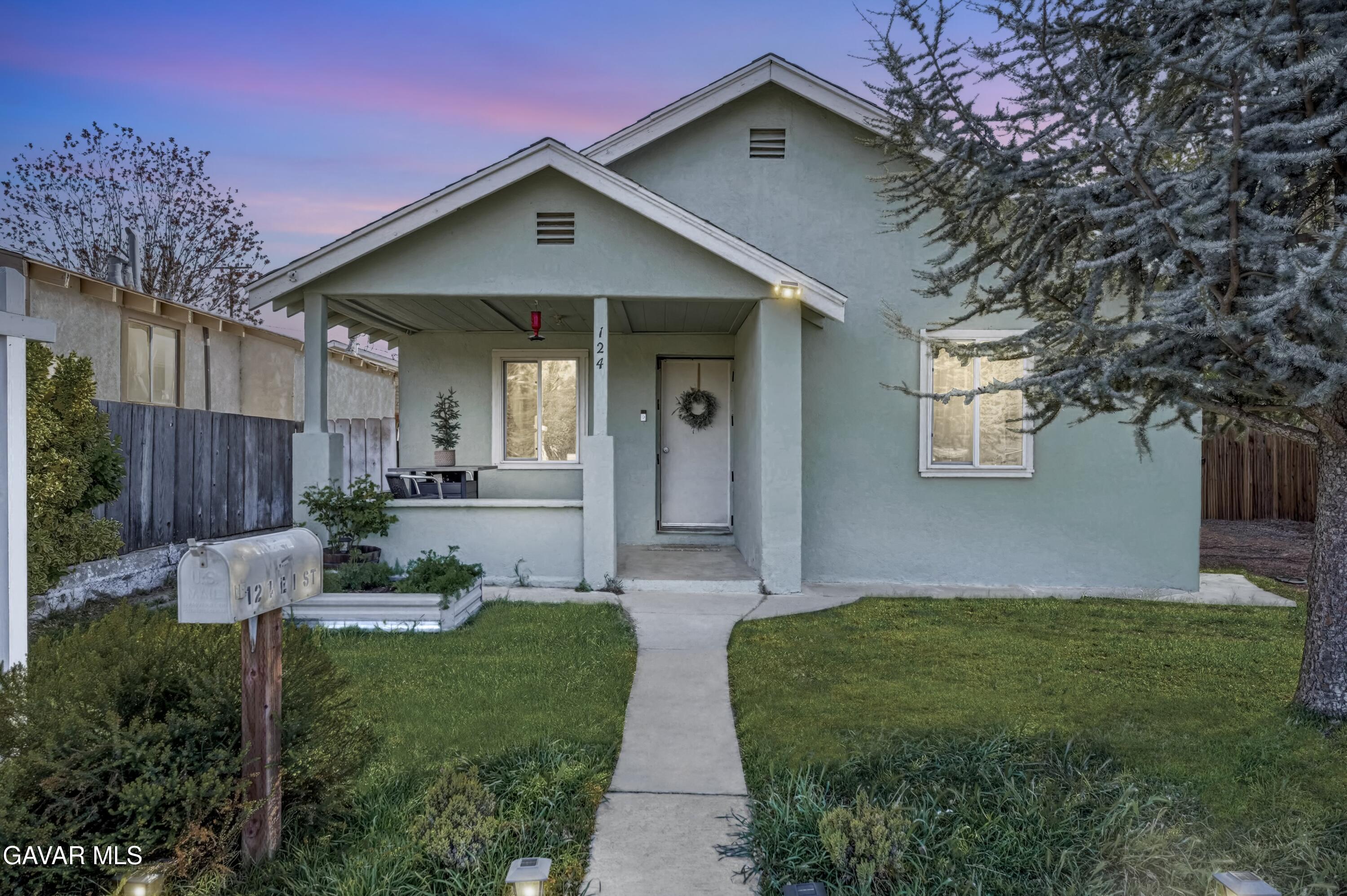 124 I Street East Tehachapi, CA 93561 - Photo 2 of 15 a front view of a house with garden