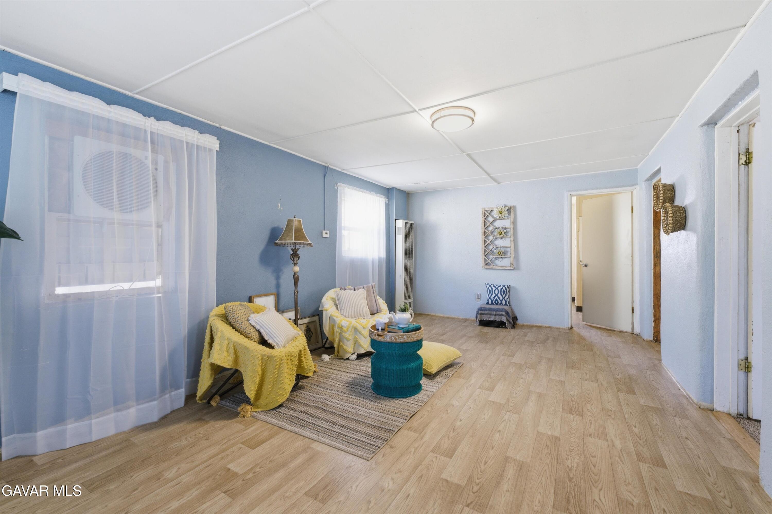 124 I Street East Tehachapi, CA 93561 - Photo 7 of 15 a living room with furniture and wooden floor