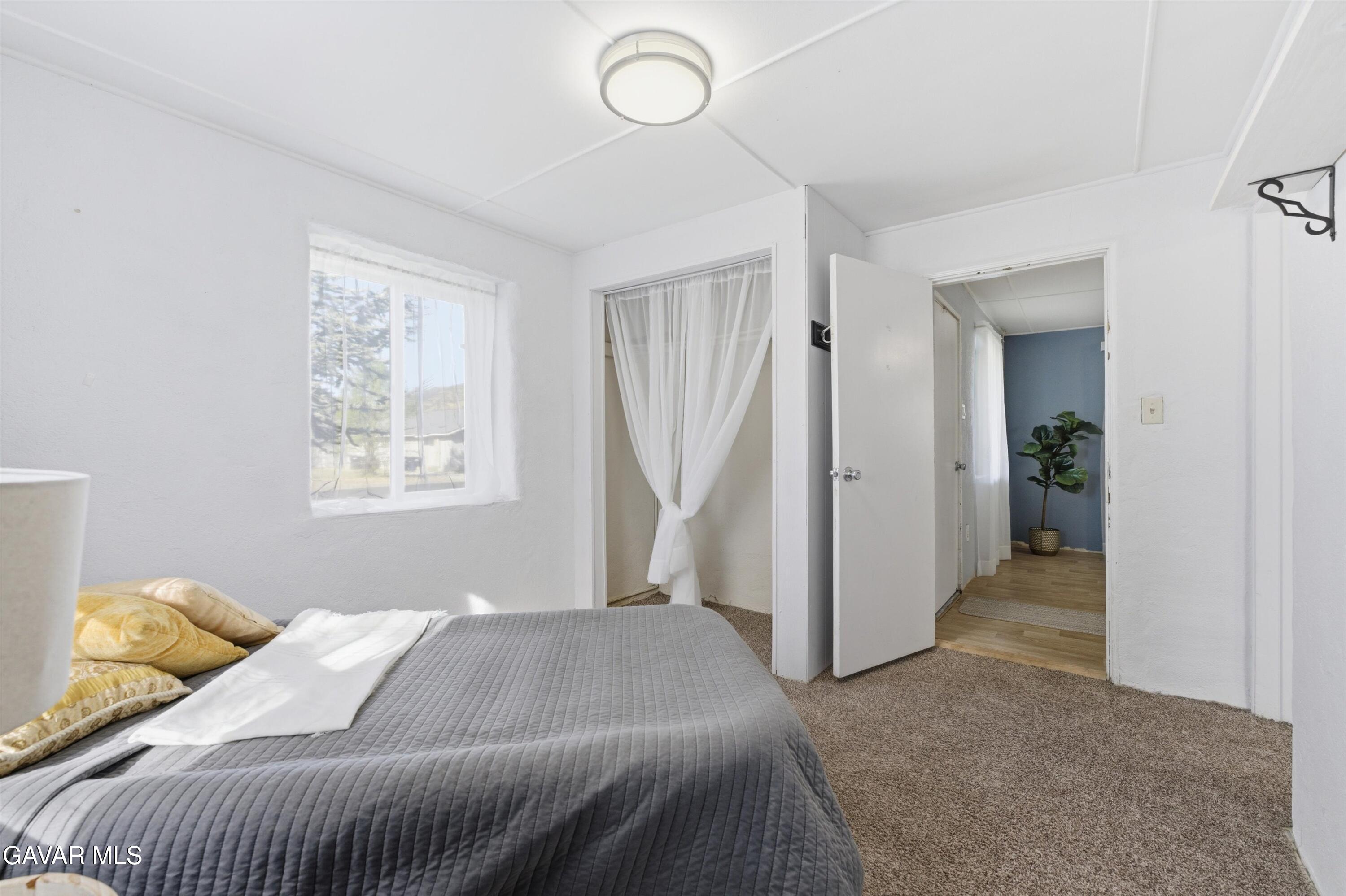 124 I Street East Tehachapi, CA 93561 - Photo 9 of 15 a bedroom with a bed and a window