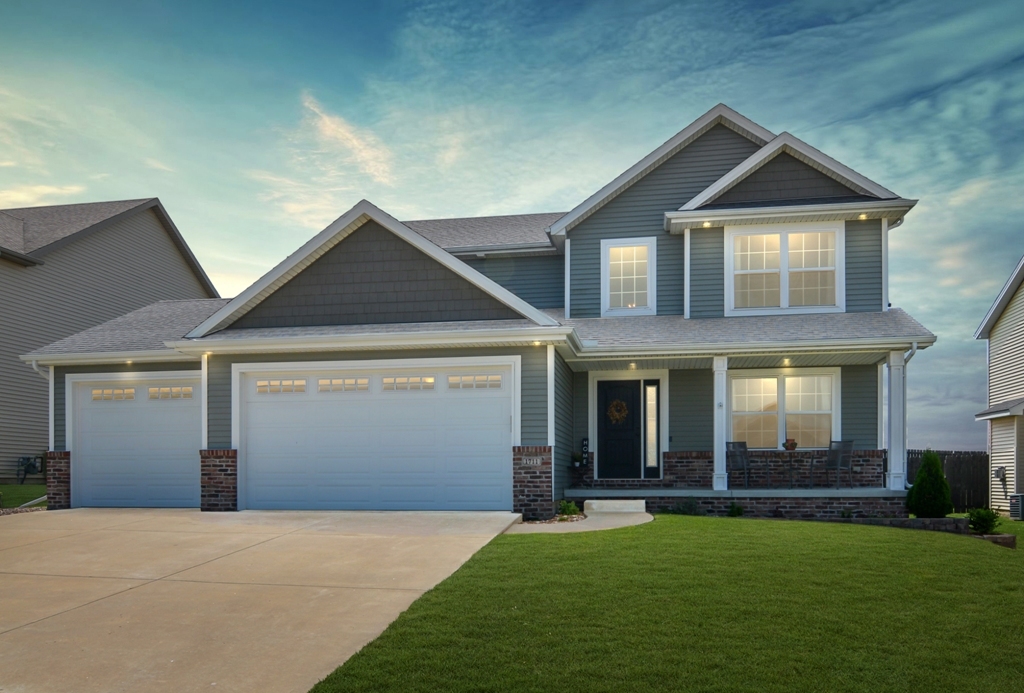 1711 Flagstone Drive Normal, IL 61761 - Photo 1 of 65 a front view of a house with a yard and garage
