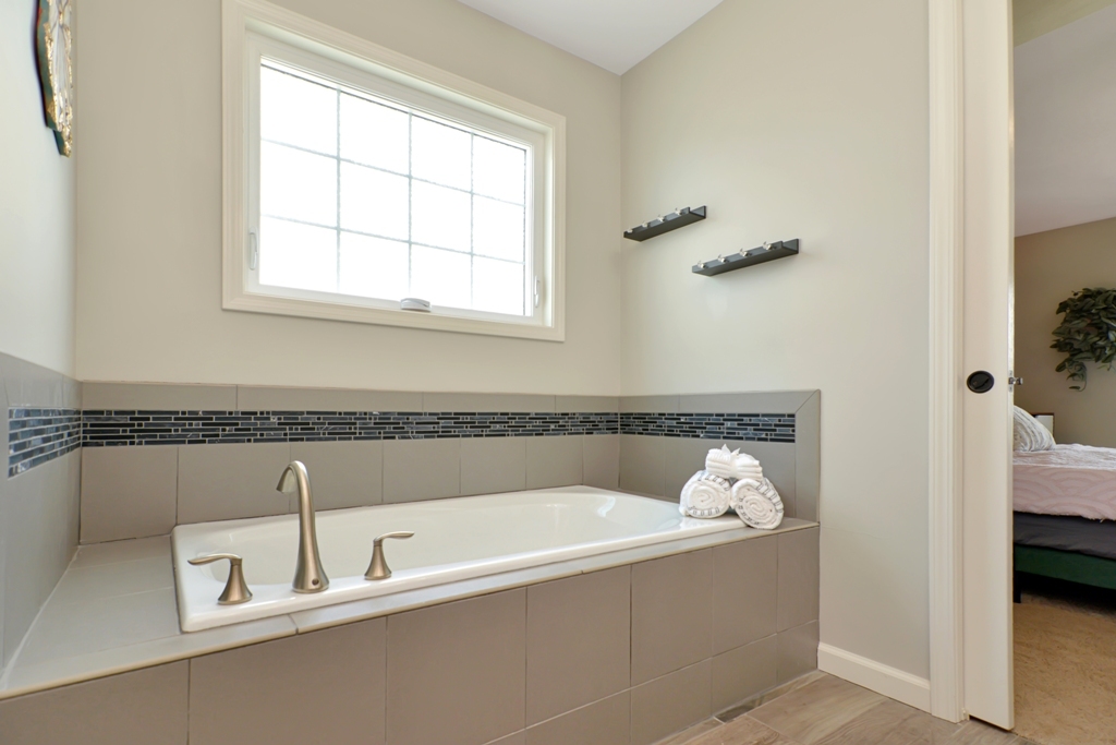 1711 Flagstone Drive Normal, IL 61761 - Photo 30 of 65 a bath tub sitting next to a window