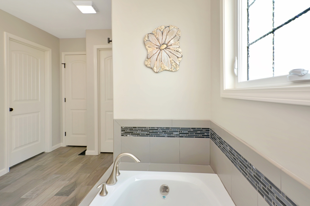 1711 Flagstone Drive Normal, IL 61761 - Photo 32 of 65 a bathroom with a tub and a window