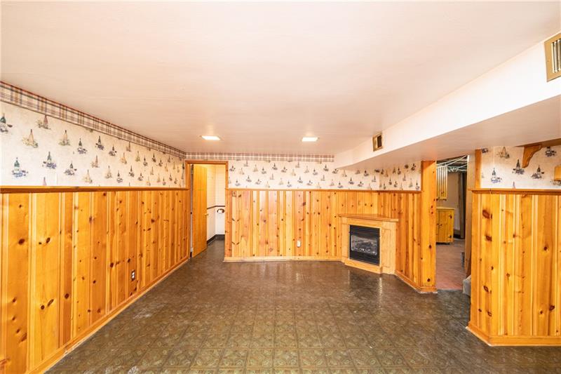 340 Orchard Spring Road Pittsburgh, PA 15220 - Photo 11 of 25 Large 26x18 foot lower level game room is perfect spot to watch your favorite sporting events & includes a gas insert fireplace.