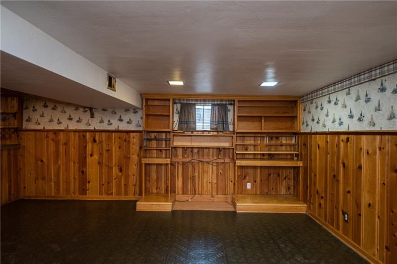 340 Orchard Spring Road Pittsburgh, PA 15220 - Photo 24 of 25 Gameroom has built in bookshelves for storing all of the classics for your reading pleasure.