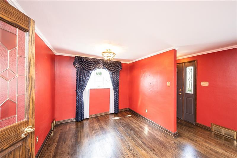 340 Orchard Spring Road Pittsburgh, PA 15220 - Photo 6 of 25 Original dining room is adjacent to the living room and kitchen.