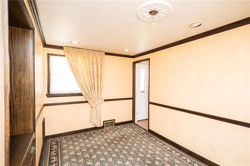 340 Orchard Spring Road Pittsburgh, PA 15220 - Photo 10 of 25 3rd bedroom was being utilized as the dining room by owner. Entry doors will be reinstalled at buyer's request prior to closing.