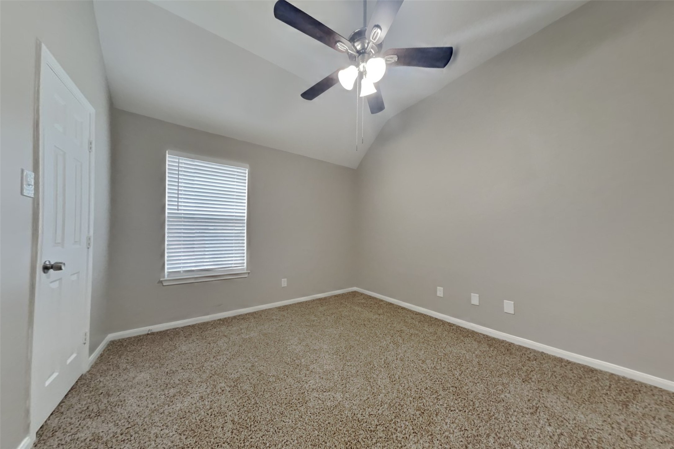 12711 Cedar Grove Court Humble, TX 77346 - Photo 16 of 20 an empty room with a window and a ceiling fan