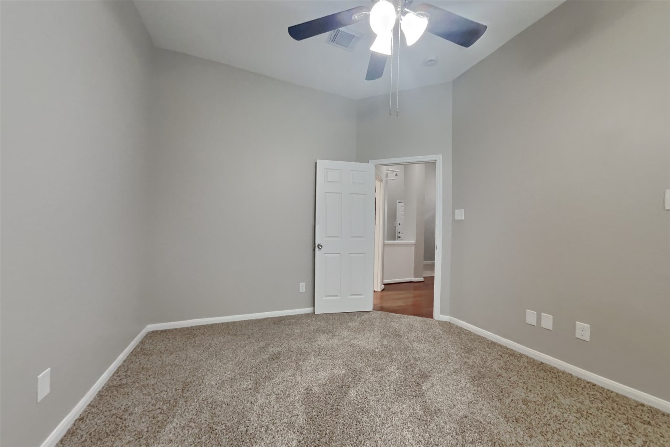 12711 Cedar Grove Court Humble, TX 77346 - Photo 17 of 20 an empty room with a chandelier fan