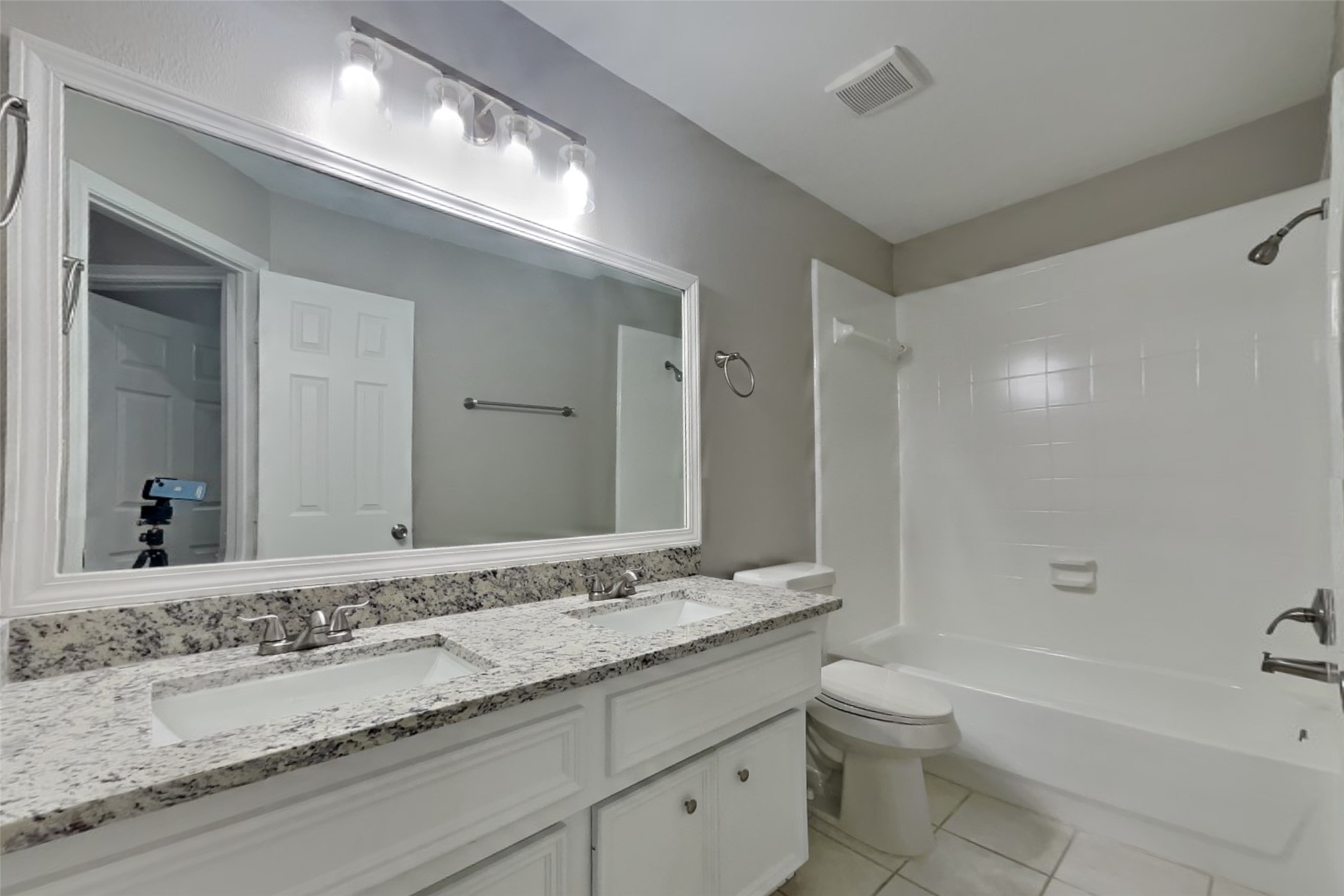 12711 Cedar Grove Court Humble, TX 77346 - Photo 18 of 20 a bathroom with a granite countertop sink mirror and toilet