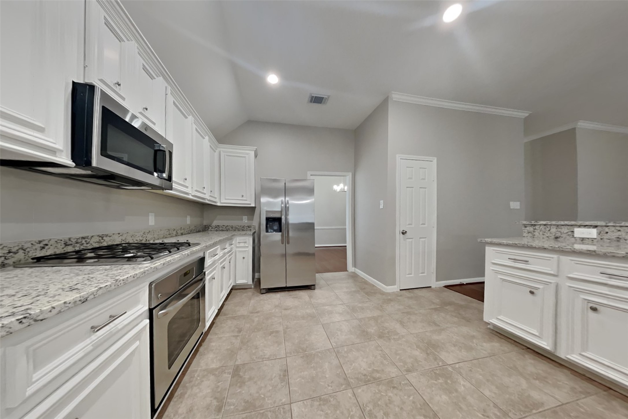 12711 Cedar Grove Court Humble, TX 77346 - Photo 5 of 20 a large kitchen with stainless steel appliances granite countertop a stove and a sink