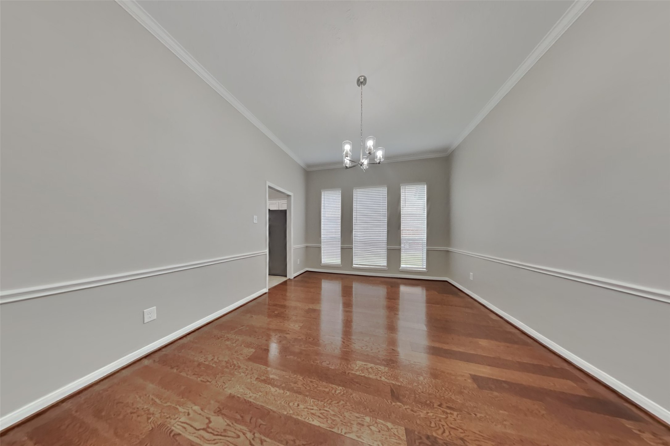 12711 Cedar Grove Court Humble, TX 77346 - Photo 7 of 20 wooden floor in an empty room with a window