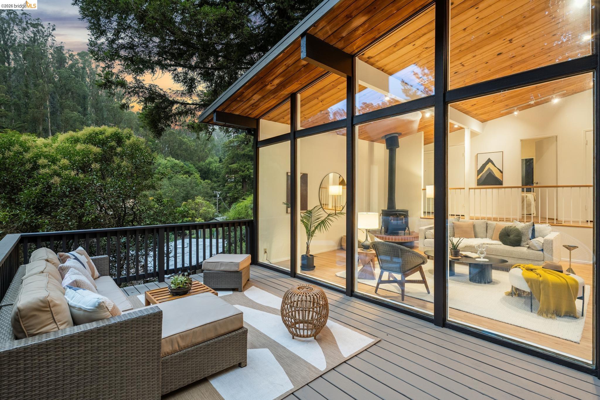 6645 Heather Ridge Way Oakland, CA 94611 - Photo 47 of 61 Expansive outdoor deck featuring composite decking and a dark-stained wood railing