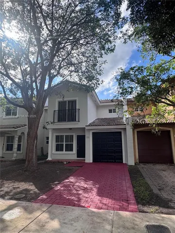 a front view of a house with yard