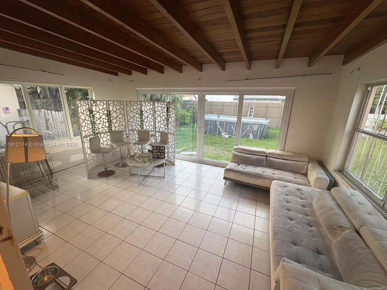 2255 Southwest 2nd Terrace Miami, FL 33135 - Photo 8 of 12 a living room with furniture and a large window