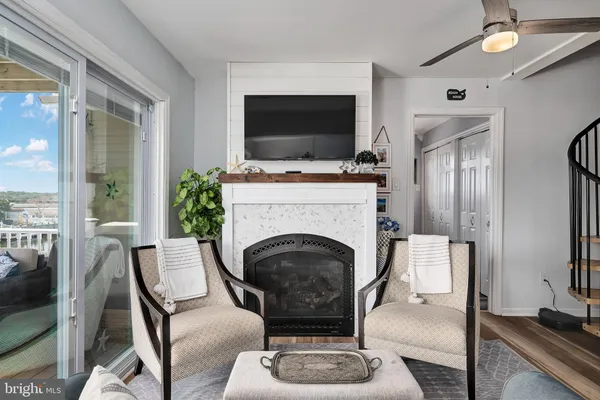 a view of a balcony with couch and wooden floor