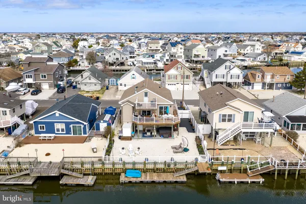 an aerial view of a house with outdoor space