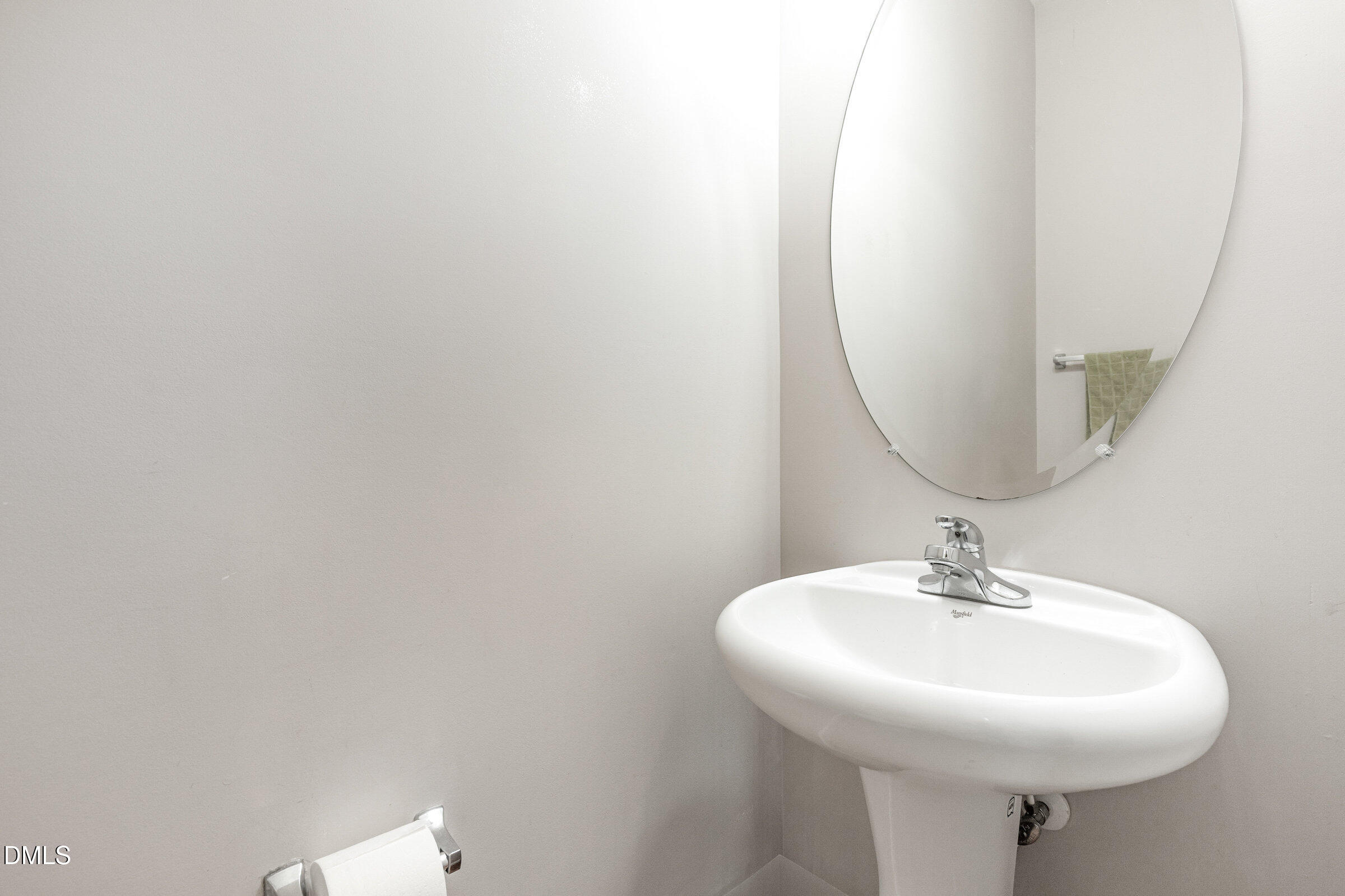 8620 Neuse Club Lane Raleigh, NC 27616 - Photo 13 of 26 a bathroom with a sink and a mirror
