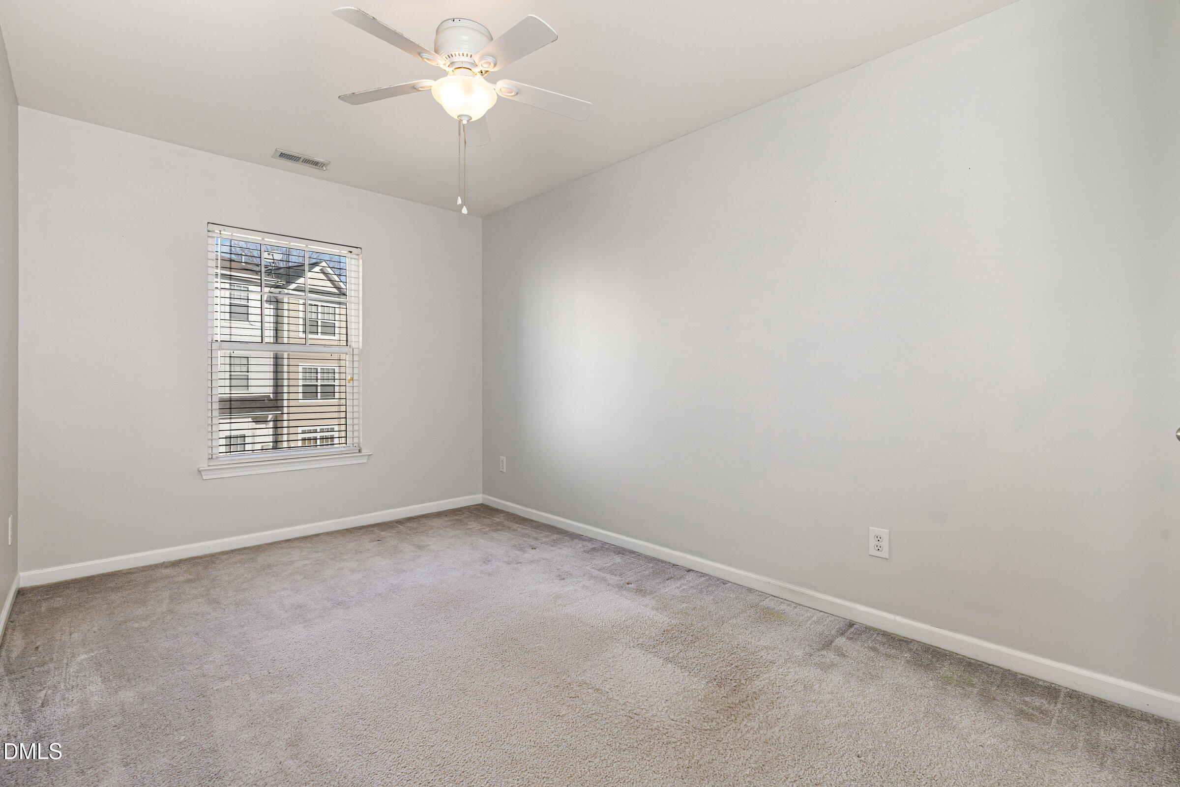 8620 Neuse Club Lane Raleigh, NC 27616 - Photo 23 of 26 a view of an empty room with a window