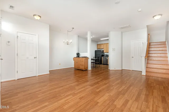 a view of kitchen with furniture and wooden floor