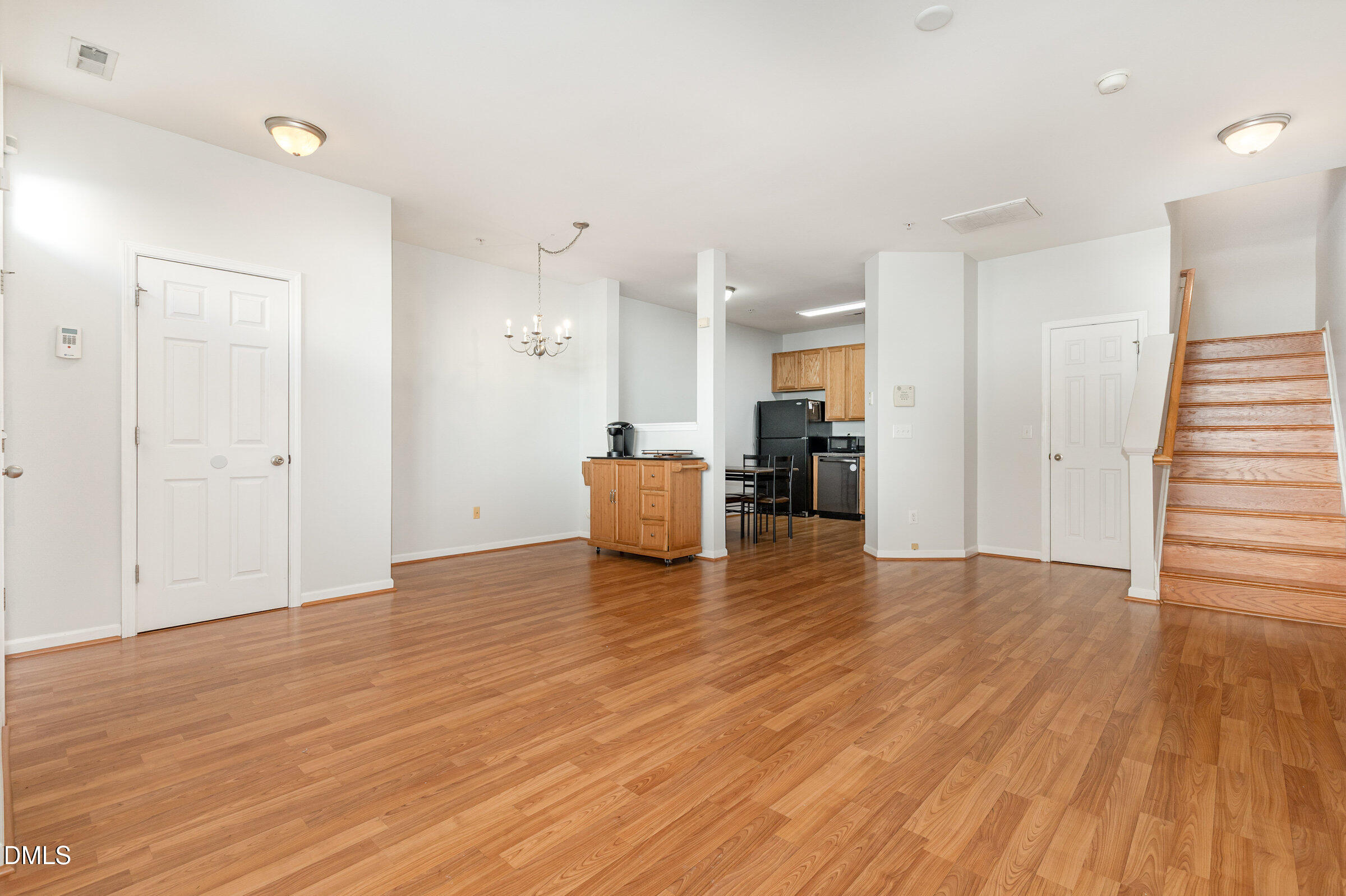 8620 Neuse Club Lane Raleigh, NC 27616 - Photo 7 of 26 a view of kitchen with furniture and wooden floor