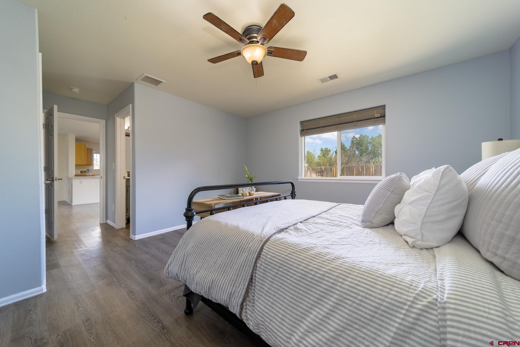 1531 Haystack Road Montrose, CO 81401 - Photo 16 of 34 a bedroom with a bed and window
