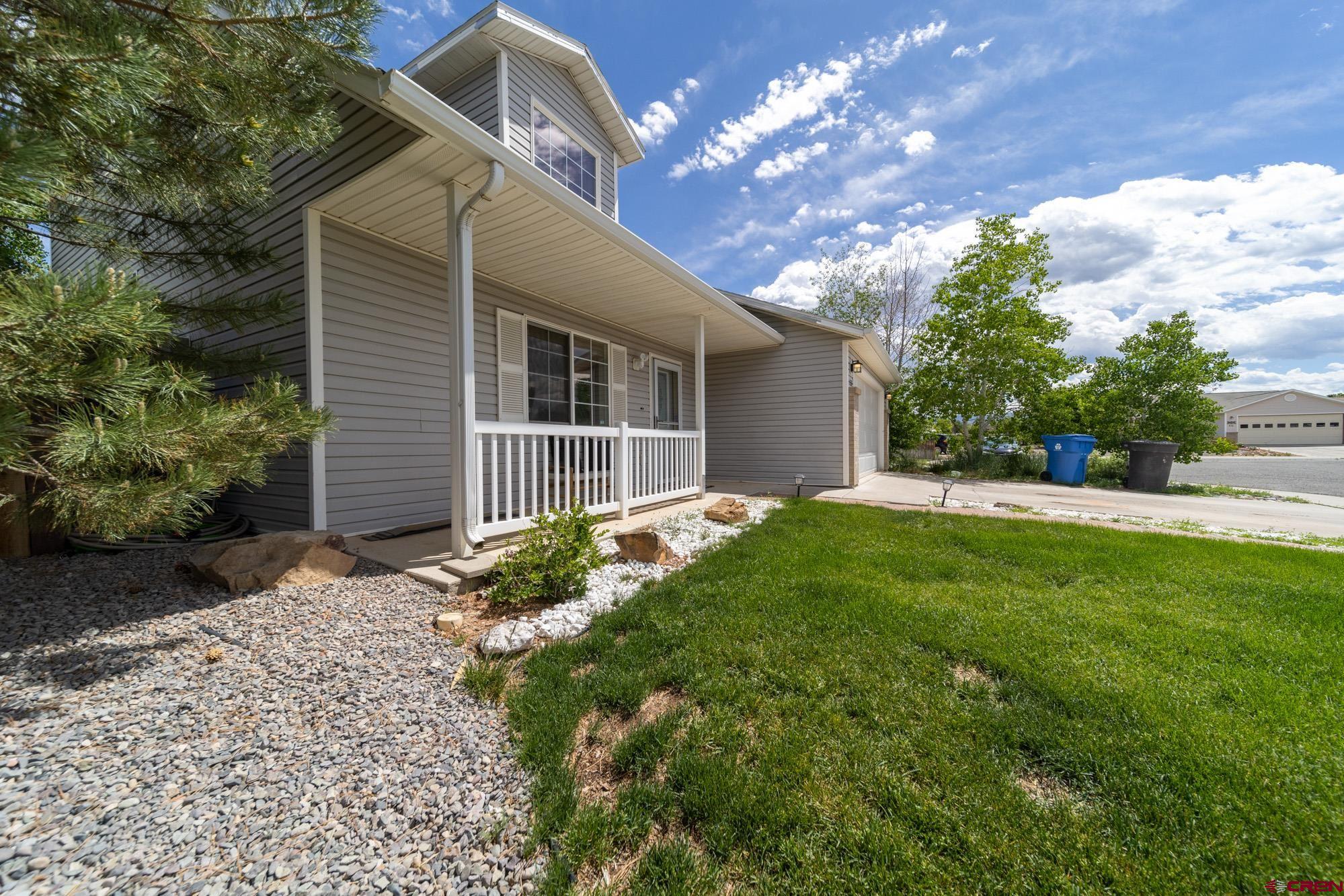 1531 Haystack Road Montrose, CO 81401 - Photo 2 of 34 a view of a house with yard and a garden