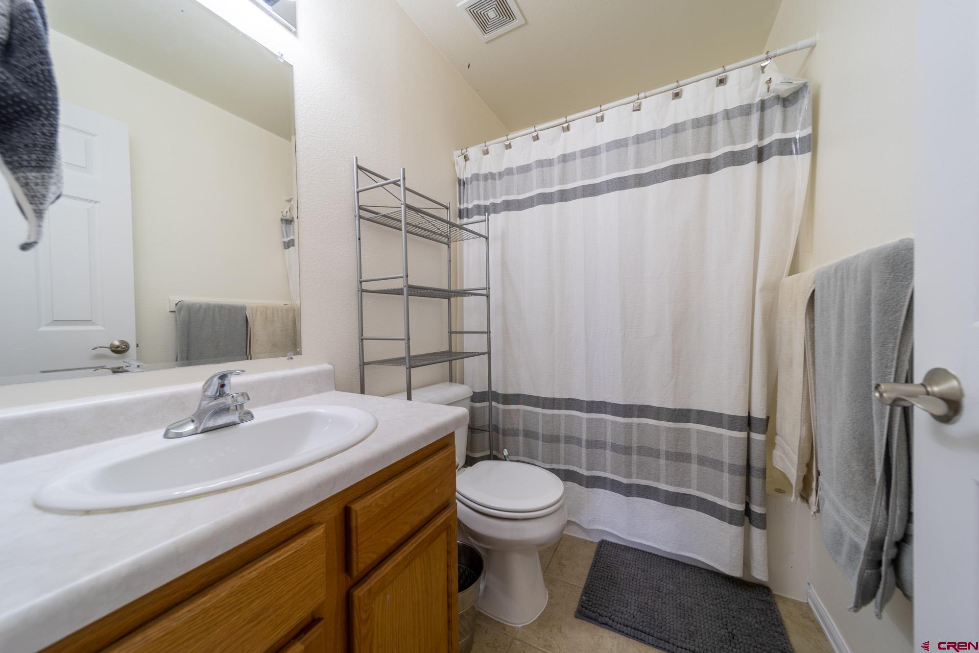 1531 Haystack Road Montrose, CO 81401 - Photo 25 of 34 a bathroom with a sink toilet and shower