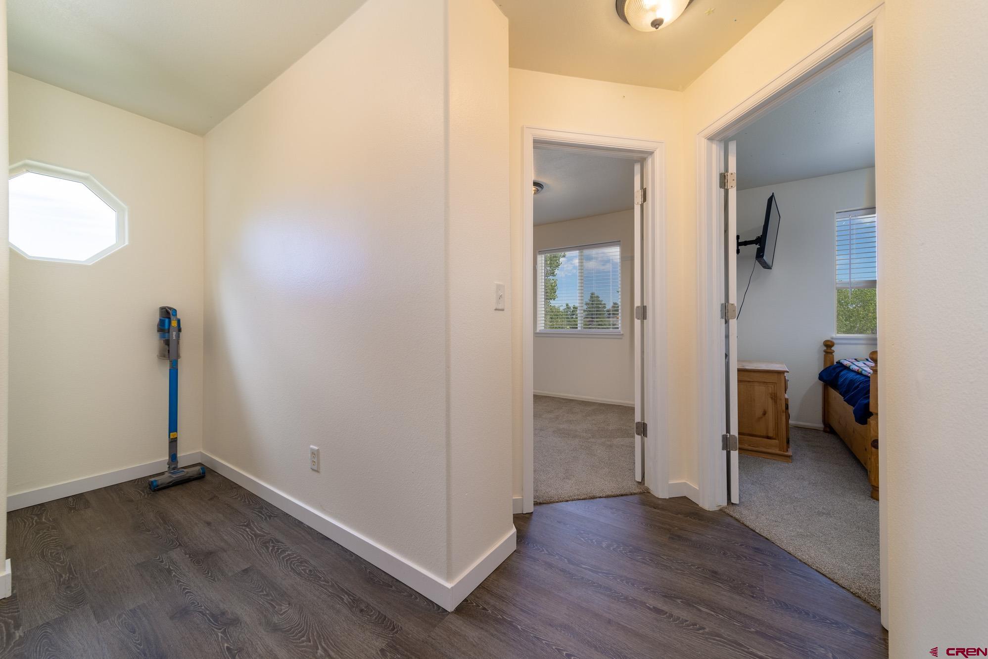 1531 Haystack Road Montrose, CO 81401 - Photo 26 of 34 an empty room and wooden door