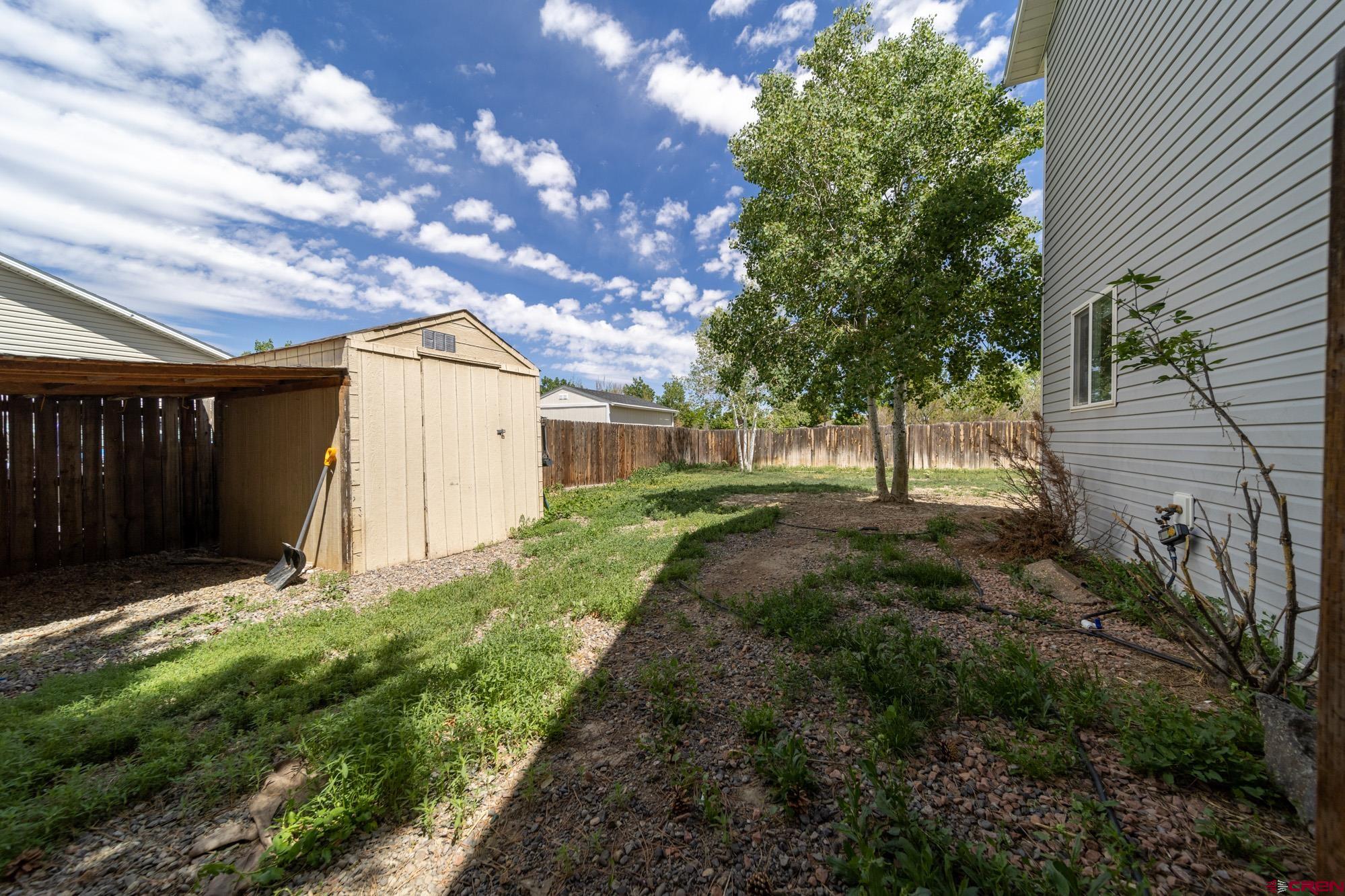 1531 Haystack Road Montrose, CO 81401 - Photo 30 of 34 a view of backyard with green space