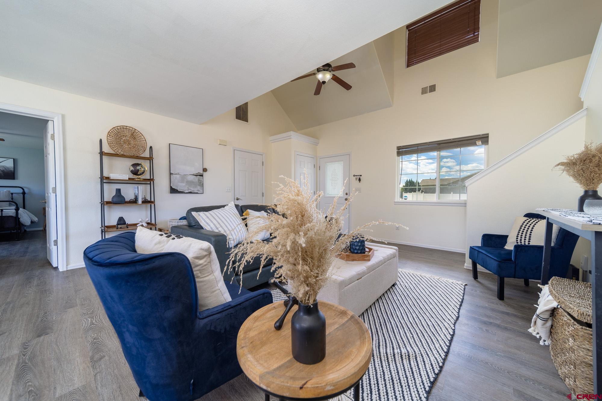 1531 Haystack Road Montrose, CO 81401 - Photo 4 of 34 a living room with furniture and a wooden floor