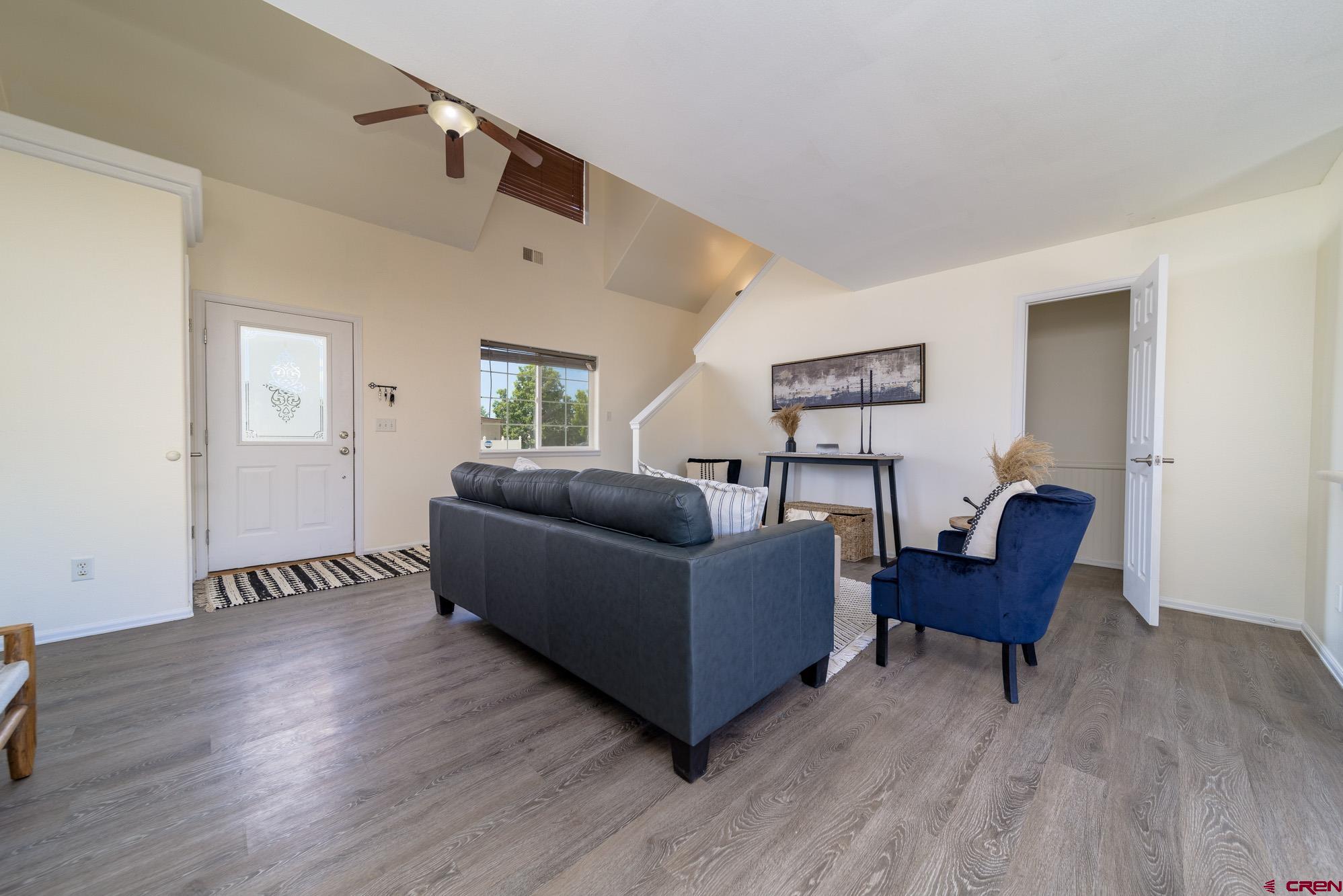 1531 Haystack Road Montrose, CO 81401 - Photo 5 of 34 a living room with furniture and a wooden floor