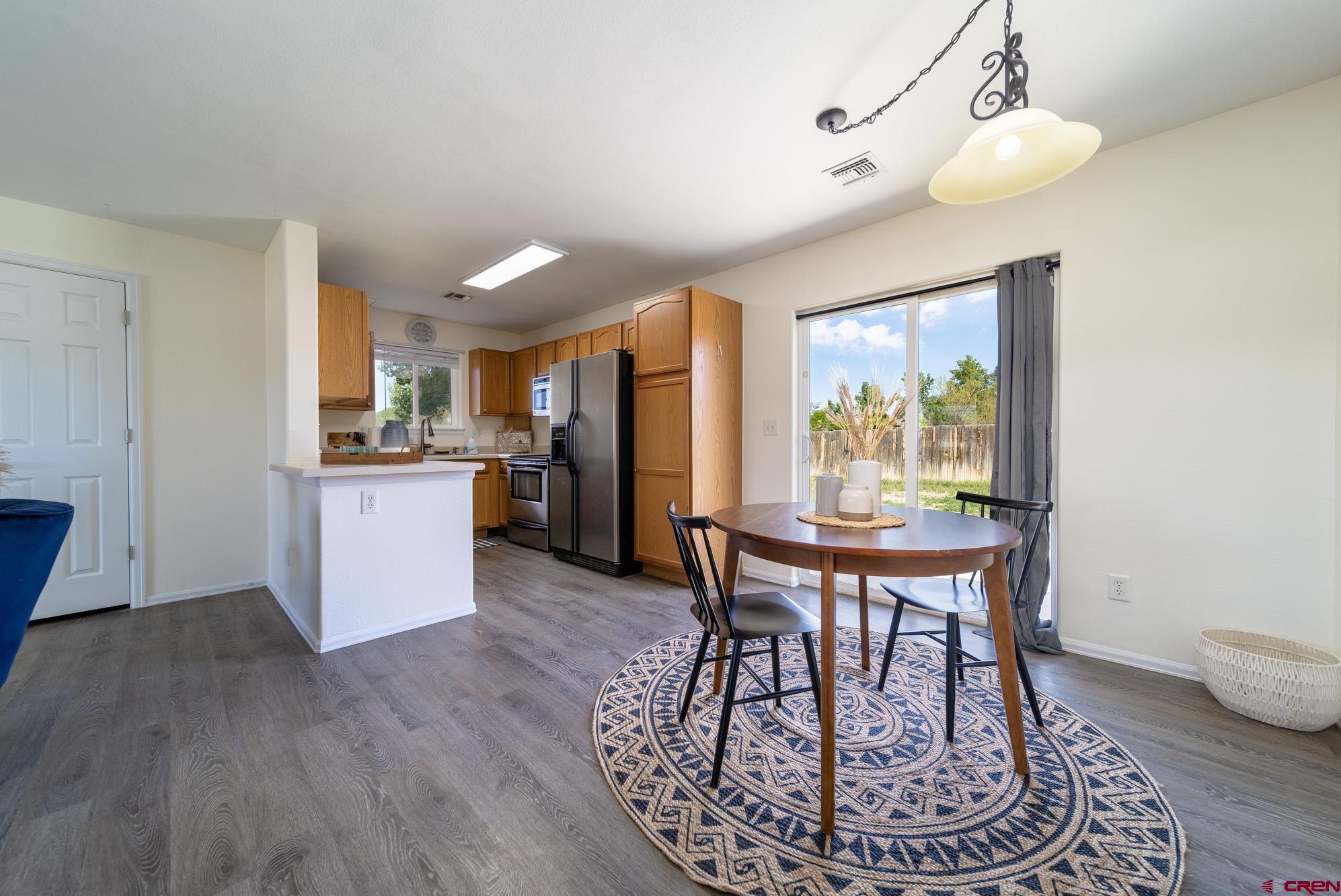 1531 Haystack Road Montrose, CO 81401 - Photo 7 of 34 a dining room with furniture and window