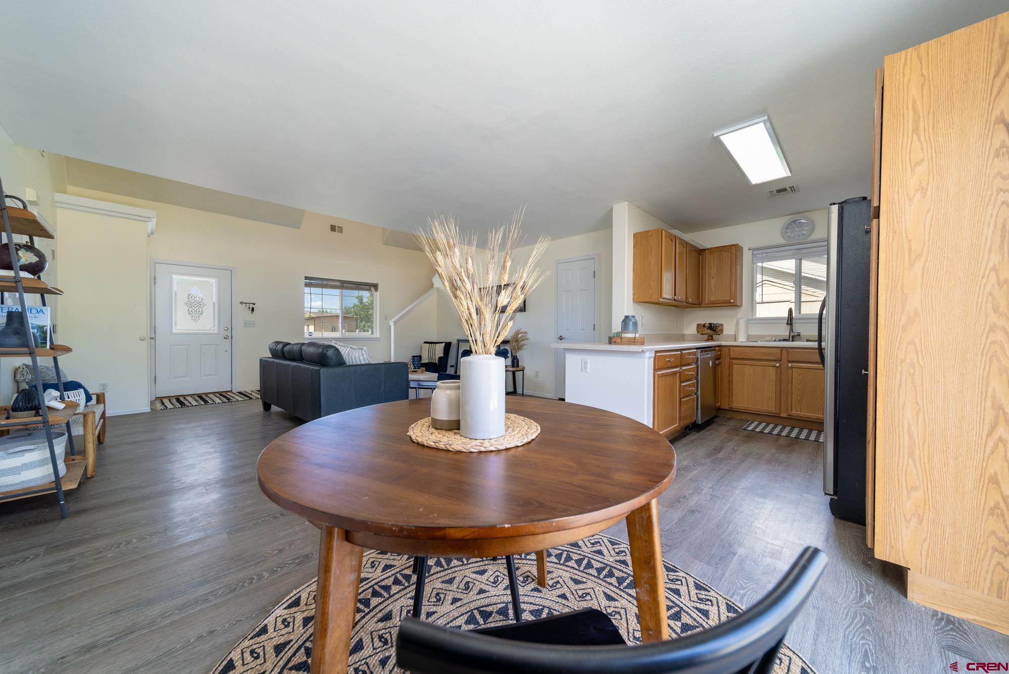 1531 Haystack Road Montrose, CO 81401 - Photo 8 of 34 a dining room with furniture and wooden floor
