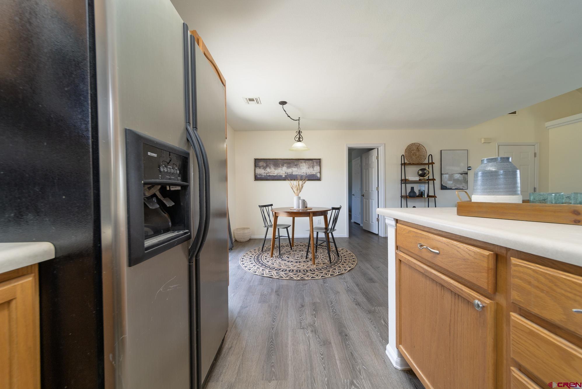 1531 Haystack Road Montrose, CO 81401 - Photo 10 of 34 a kitchen with stainless steel appliances granite countertop a refrigerator and microwave