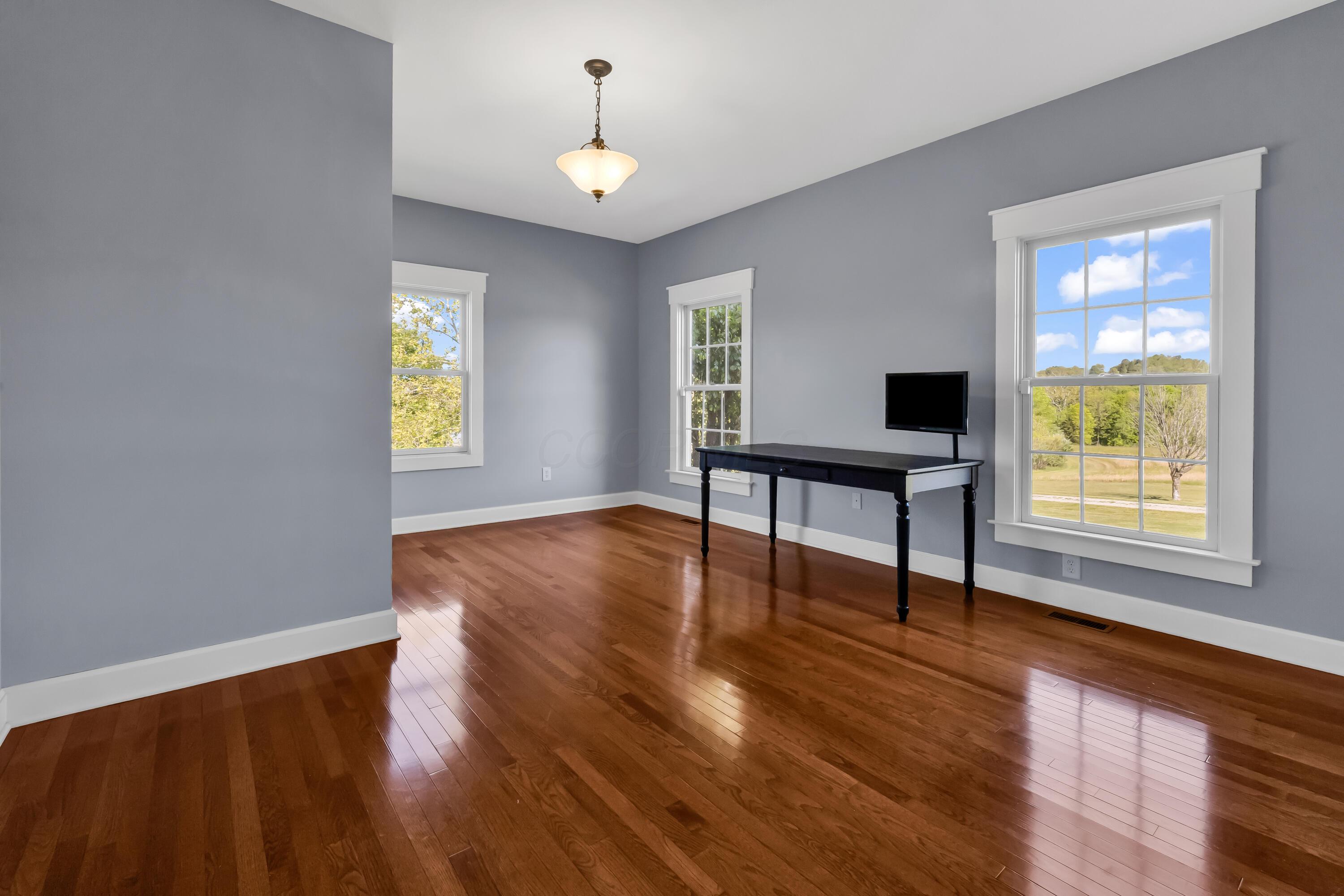 16689 Bailor Road Laurelville, OH 43135 - Photo 7 of 73 • Hardwood flooring
• Grey painted walls
• Pocket door
• Chandelier