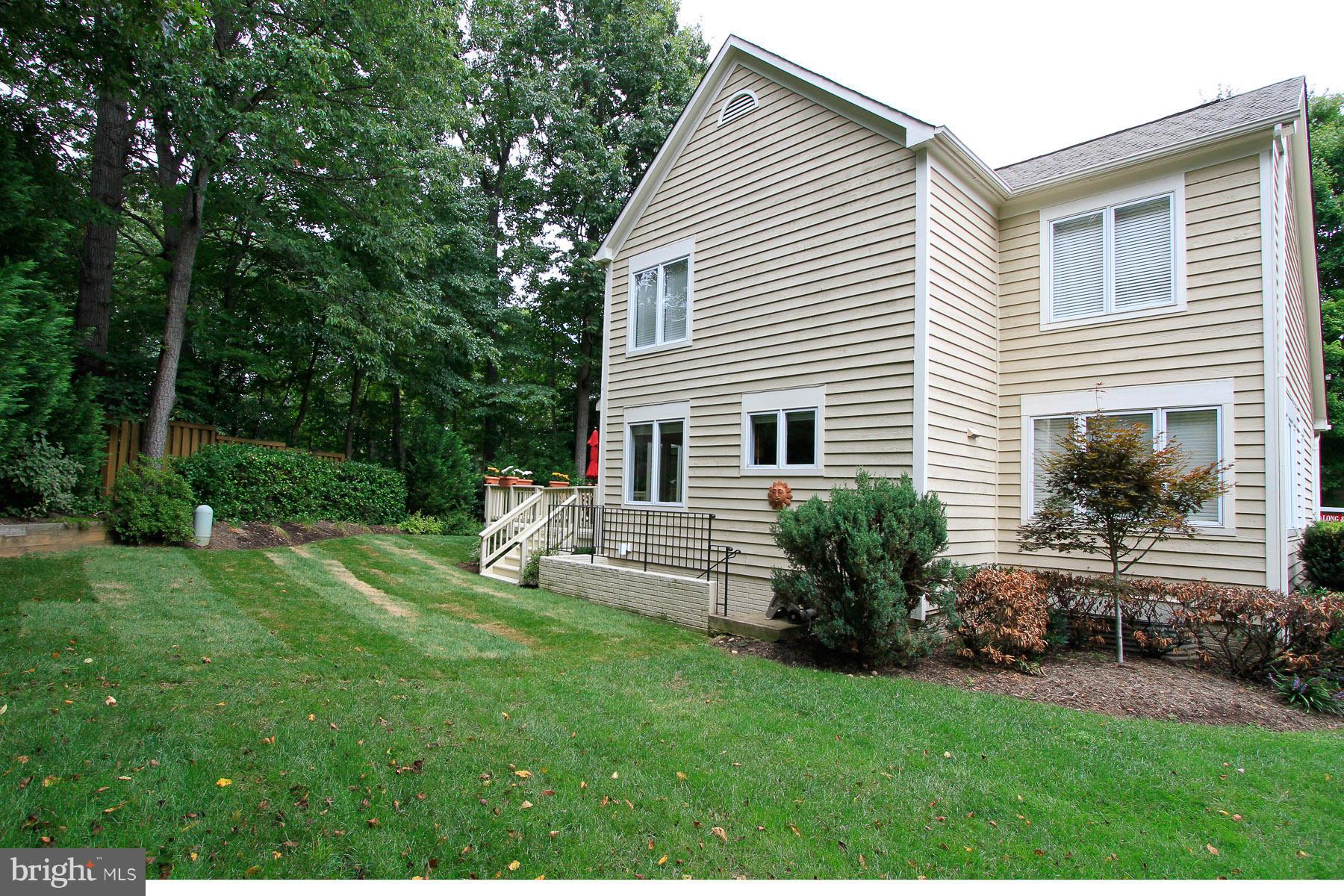 1304 Pavilion Club Way Reston, VA 20194 - Photo 3 of 30 a view of house with backyard and garden