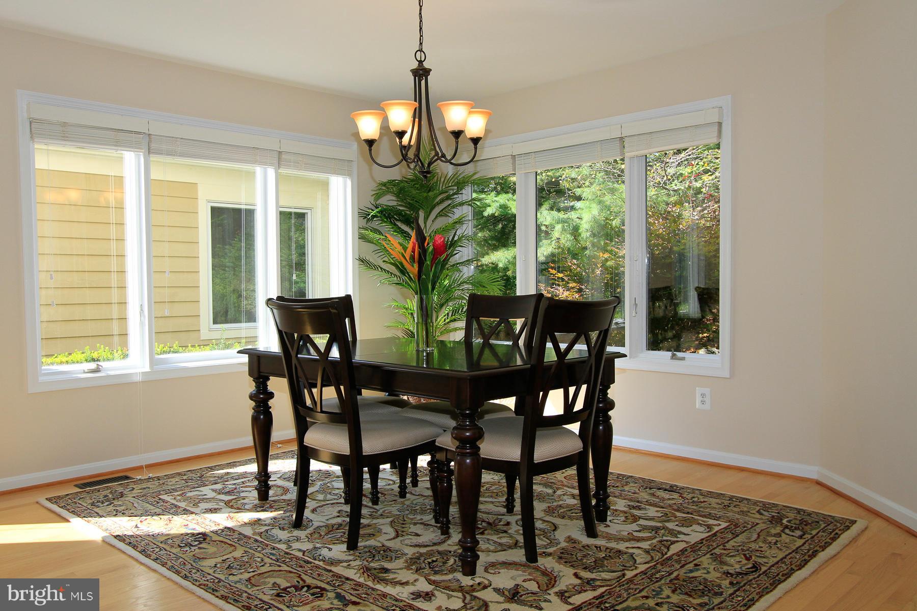 1304 Pavilion Club Way Reston, VA 20194 - Photo 7 of 30 a view of a dining room with furniture window and outside view