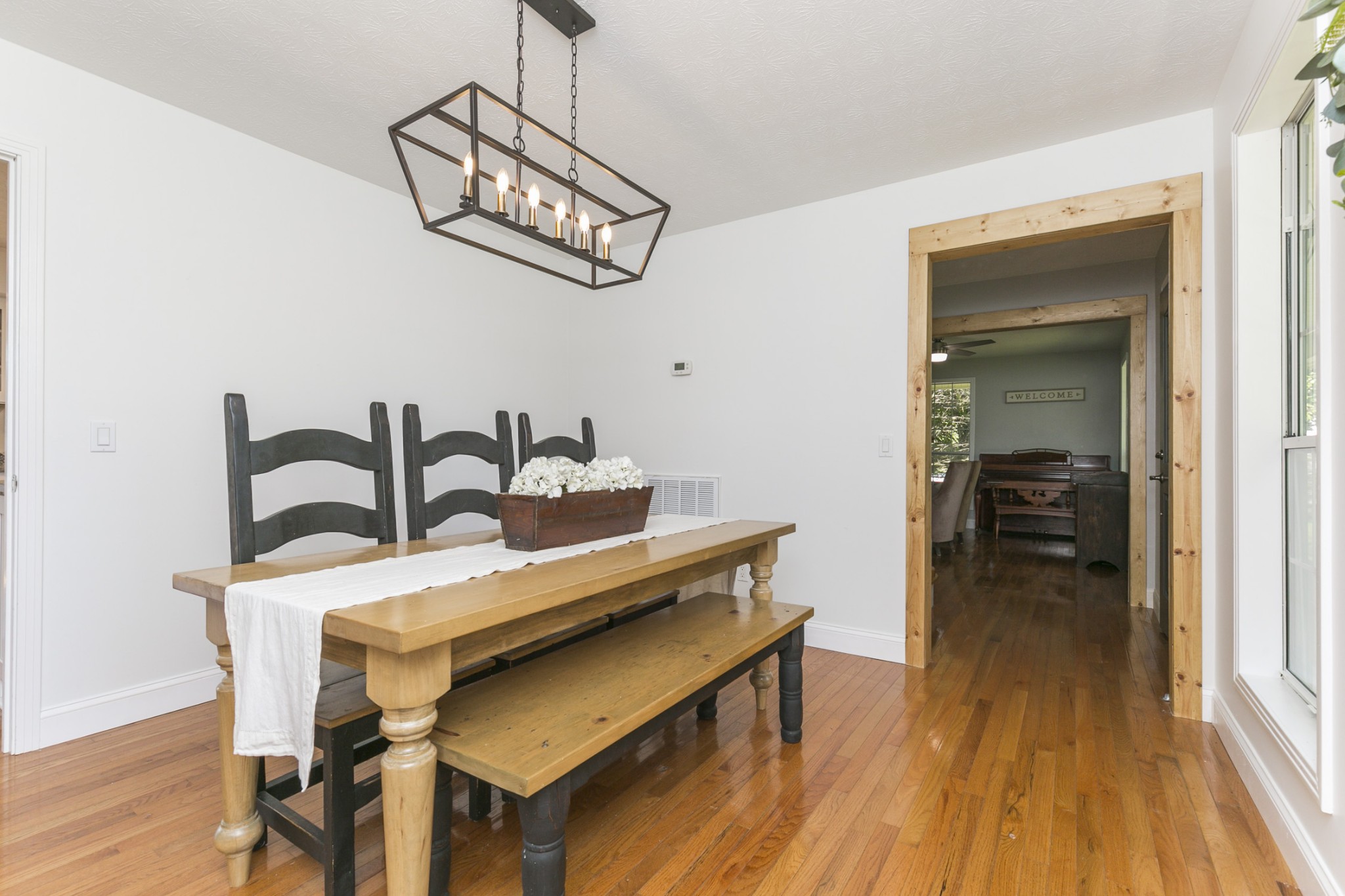 848 Philadelphia Road Lebanon, TN 37087 - Photo 11 of 50 a view of a dining room with furniture and wooden floor
