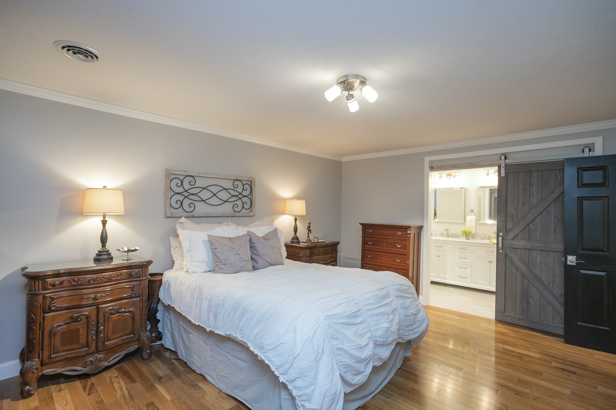 848 Philadelphia Road Lebanon, TN 37087 - Photo 19 of 50 a bedroom with a bed and wooden floor