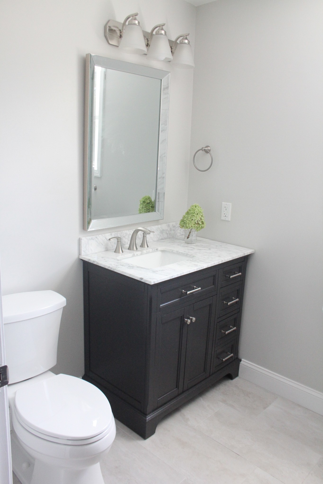 848 Philadelphia Road Lebanon, TN 37087 - Photo 30 of 50 a bathroom with a sink vanity mirror and toilet